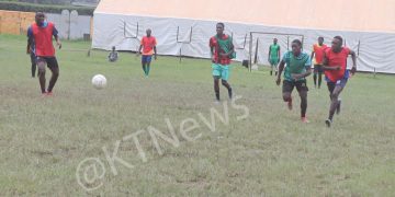 Football players training next to the church in question
