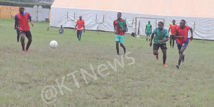 Football players training next to the church in question