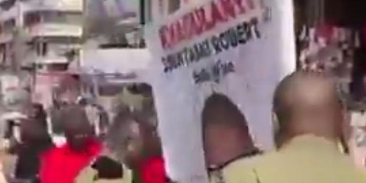 Police Probe Viral Videos of Officers Defacing Kyagulanyi’s Posters