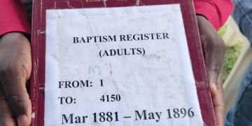 Historic Record: Catholic Church Displays First Baptism Register from 1881